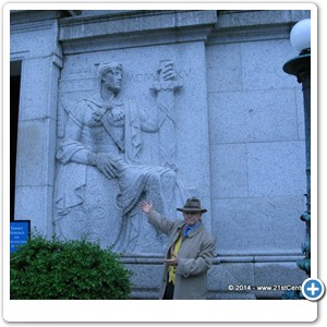 Dr. Bob posing next to "the Guardian of the Portal" relief outside the National Archives building. This building houses original copies of the three main formative documents of the United States and its government: the Declaration of Independence, the Constitution, and the Bill of Rights.